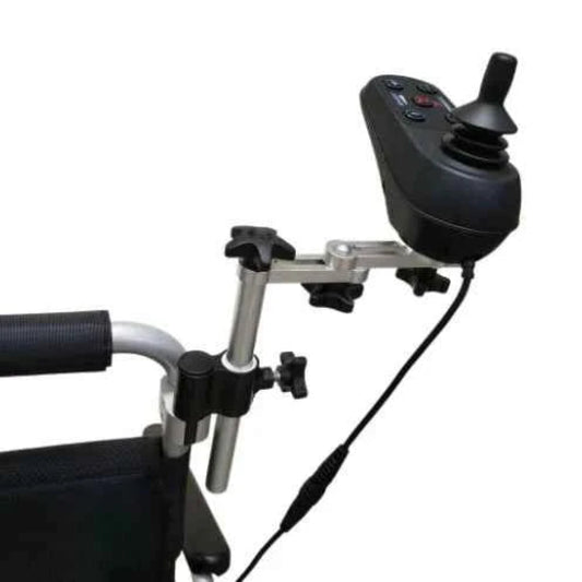 Close-up of the Travel Buggy caregiver joystick mount securing the controller to the wheelchair frame for versatile steering.