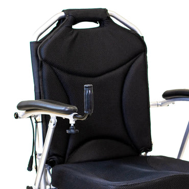 Travel Buggy mobility support grab bar securely mounted to the seat frame of a power wheelchair to assist with safe standing and transitions.