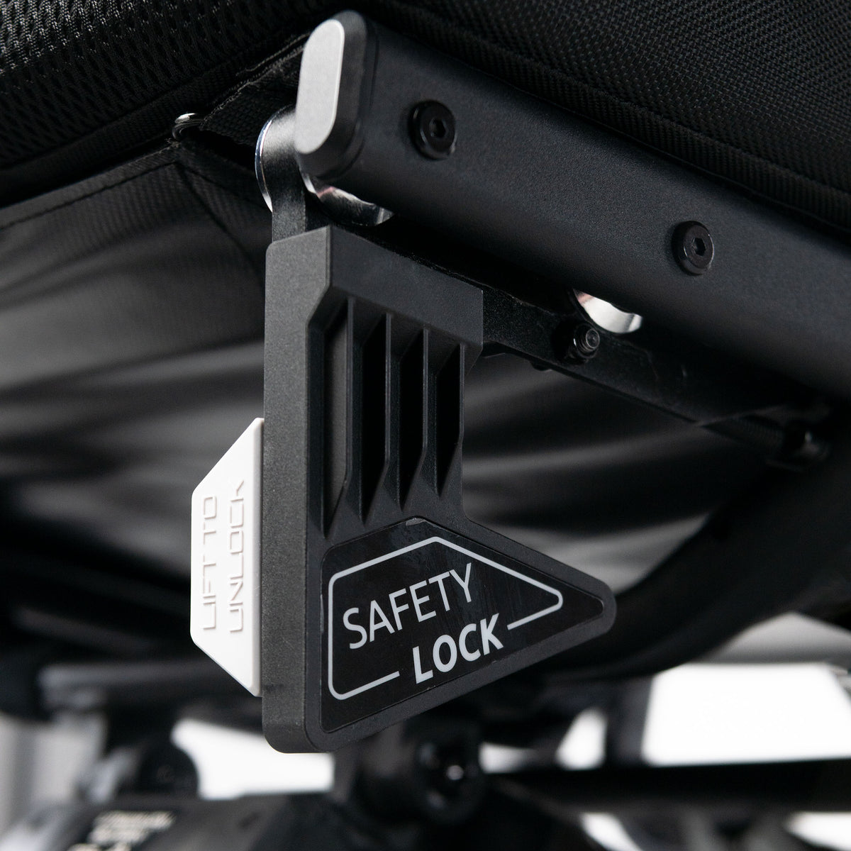 Travel Buggy Grand Tourer GT safety lock close-up beneath the seat