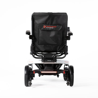 White Travel Buggy Grand Tourer GT power wheelchair, rear view showing the backrest pocket and rear light