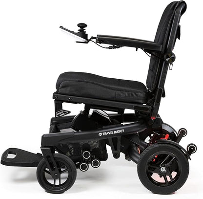 Side profile of the Travel Buggy Grand Tourer GT electric wheelchair featuring large rear wheels and ergonomic armrests.