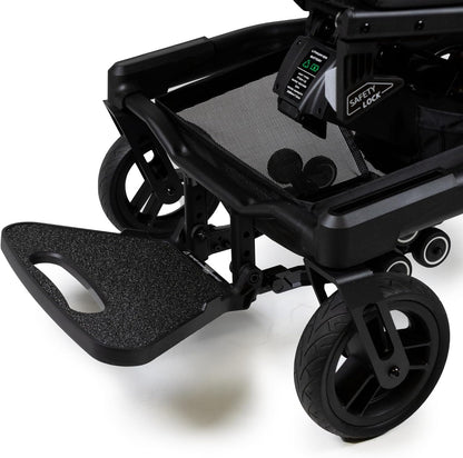 Detailed view of the sturdy rear tires and safety anti-tip wheels on the Travel Buggy Grand Tourer GT power chair.