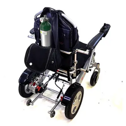Travel Buggy oxygen tank holder securely mounted to the back of a power wheelchair, safely carrying a standard oxygen cylinder.
