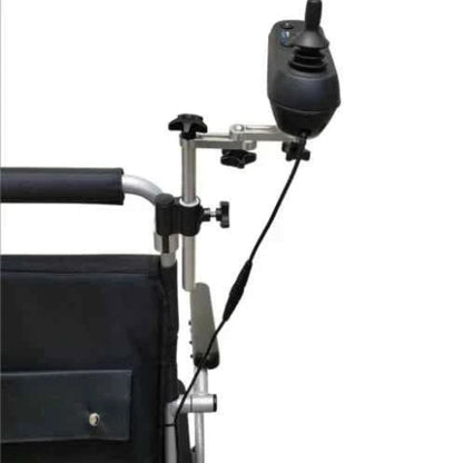 Travel Buggy power wheelchair featuring the caregiver joystick mount installed on the rear backrest for easy collaborative control.