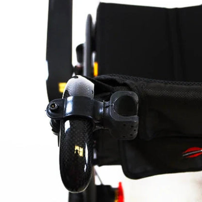 Travel Buggy universal cane holder securely mounted to the back of a power wheelchair carrying a walking cane.