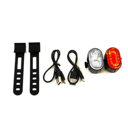 Unboxed Travel Buggy LED safety light set showing the lights, mounting straps, and USB charging cables.