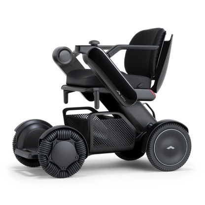WHILL Model C2 power wheelchair with black arm covers, studio view
