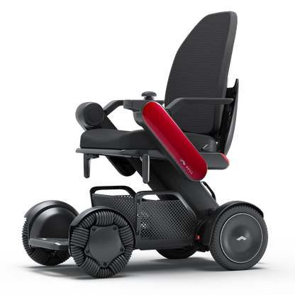 WHILL Model C2 High Back power wheelchair with red arm covers, studio view