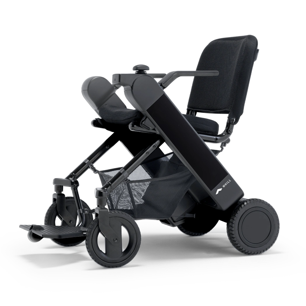 WHILL Model F folding power wheelchair with black arm covers, studio view