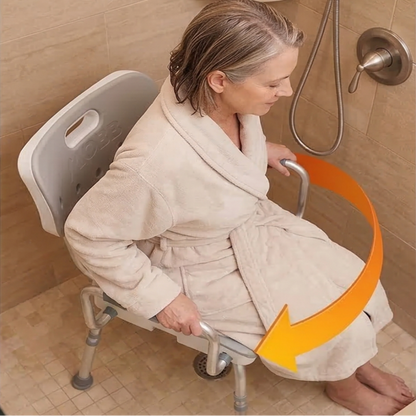 Lifestyle shot of a woman in a bathrobe safely sitting on the MOBB Swivel Shower Chair inside a standard bathtub.