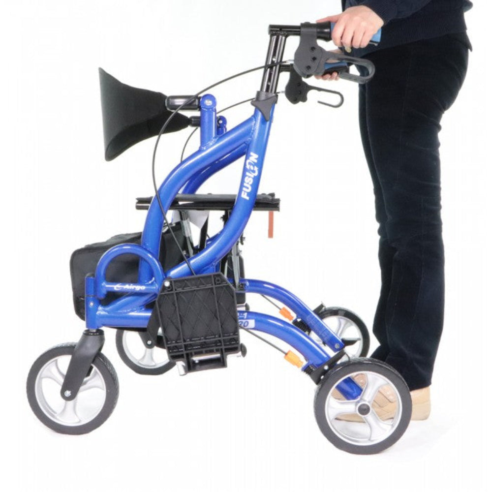 Lifestyle shot of a woman confidently walking indoors using the blue Airgo Fusion F20 rollator for independent mobility support.