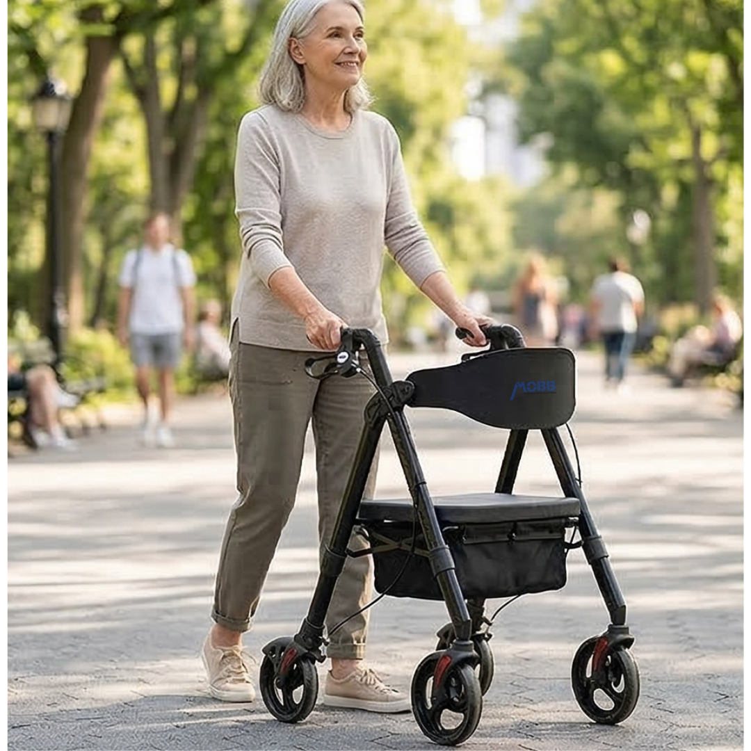 Lifestyle image of a woman confidently walking outdoors on a sunny day using the black MOBB aluminum folding rollator.